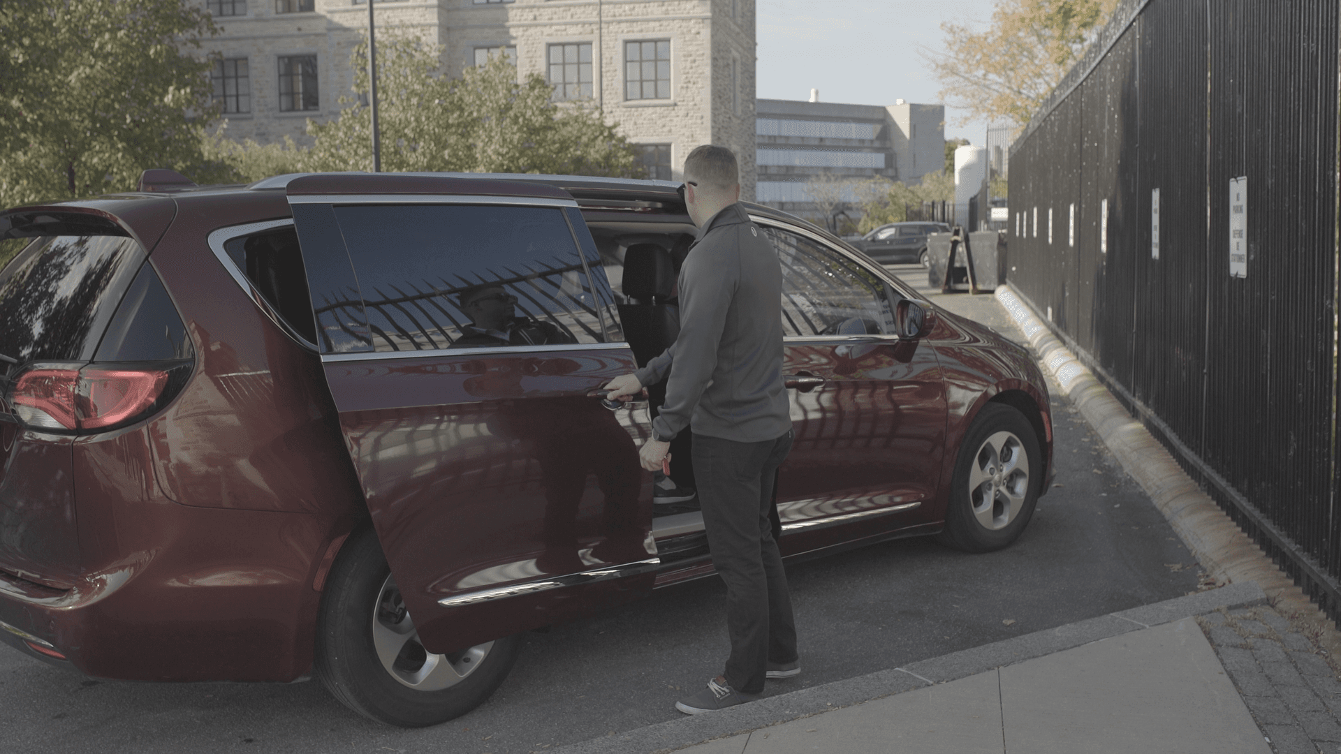 Guide helping guests out of van